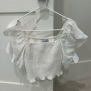 White stretchy crop top with puffy sleeves